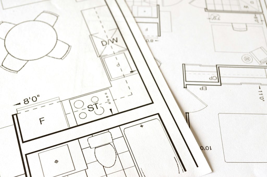 pexels photo 271667 271667 Close-up view of an architectural floor plan on paper showcasing detailed room layouts and measurements.